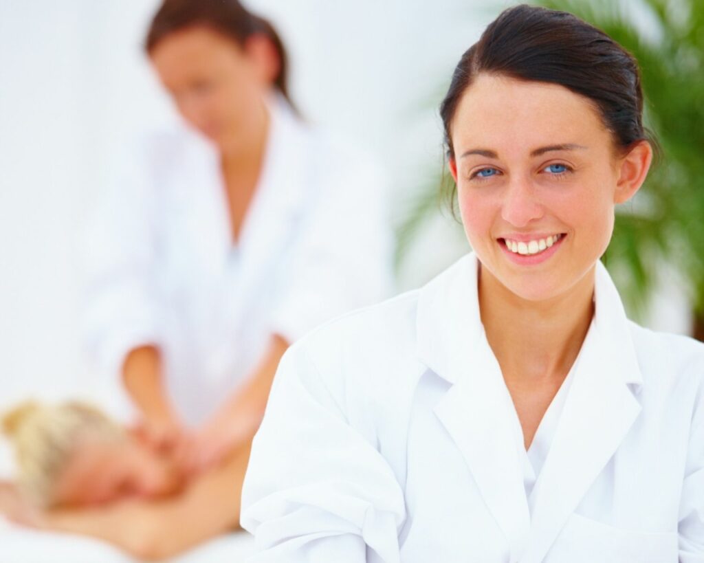 Smiling beauty therapist